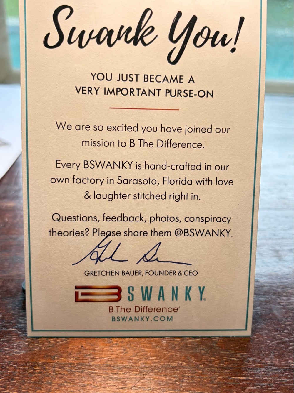 SWANK Cream Card with Teal Border and Black Script